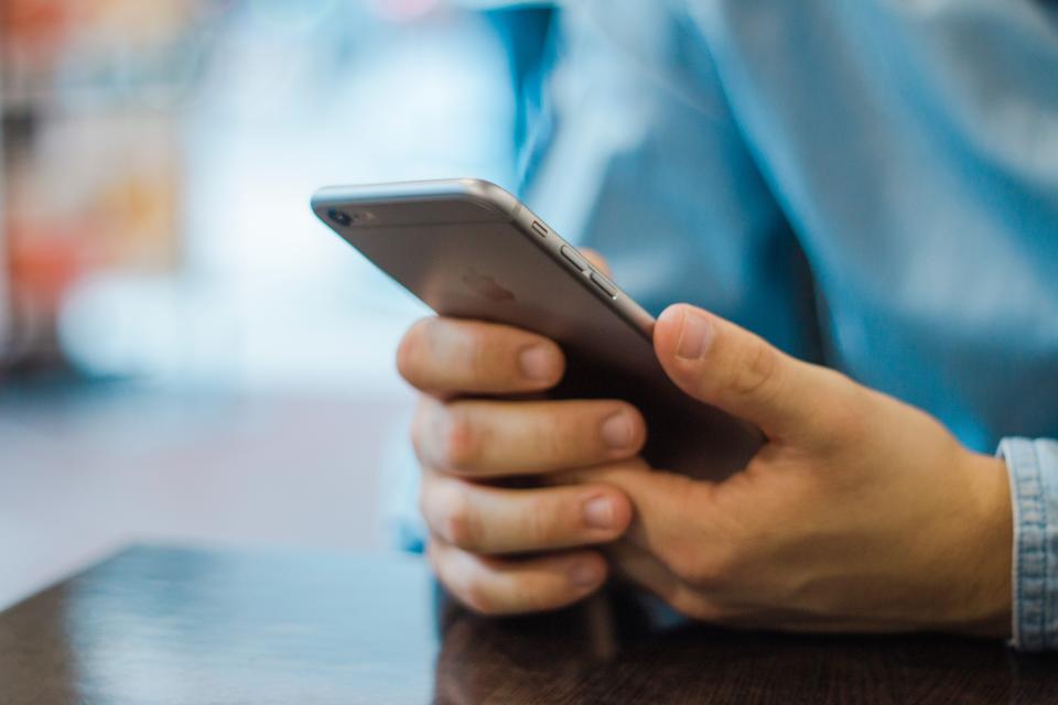 Close-up of hands holding a smartphone